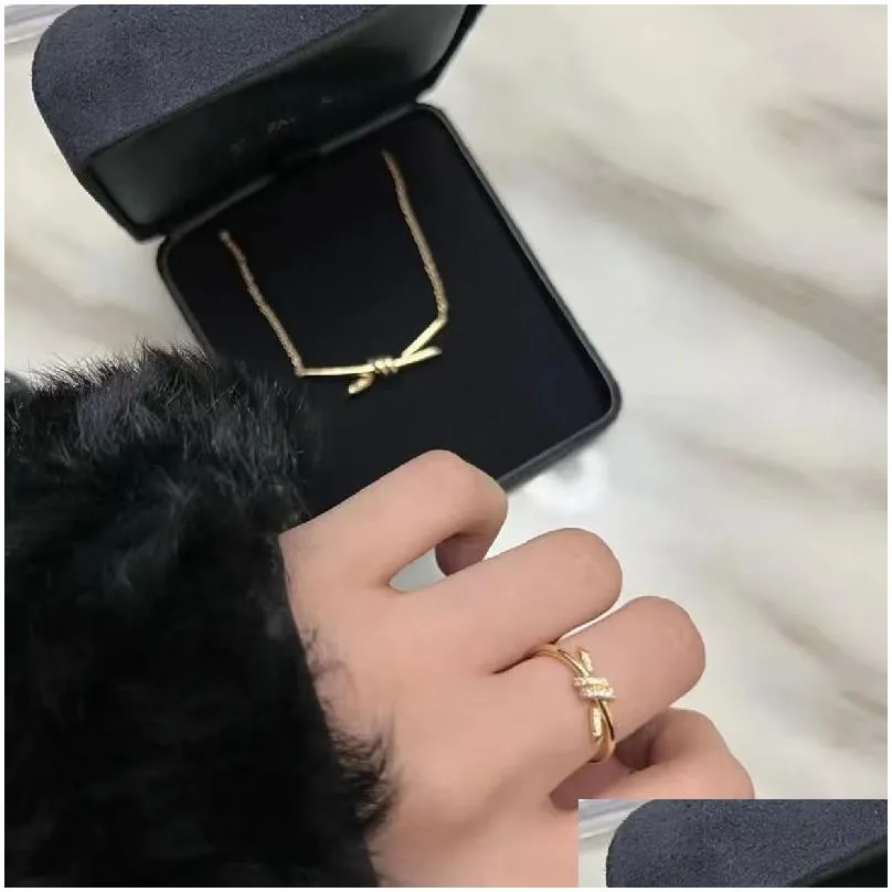 Pendant Necklaces High Quality Designer For Woman Classic Gold Plated Europe America Fashion Knot Diamond Necklace Wedding Party Val Dh4Pi