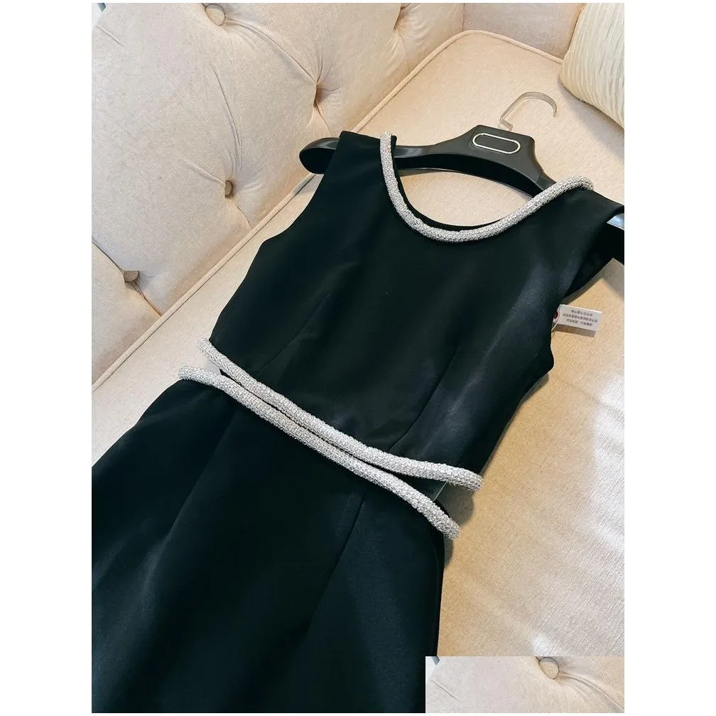 Spring Autumn White / Black Solid Color Beaded Dress Sleeveless Round Neck Hollow Out Rhinestone Midi Casual Dresses D4A073256