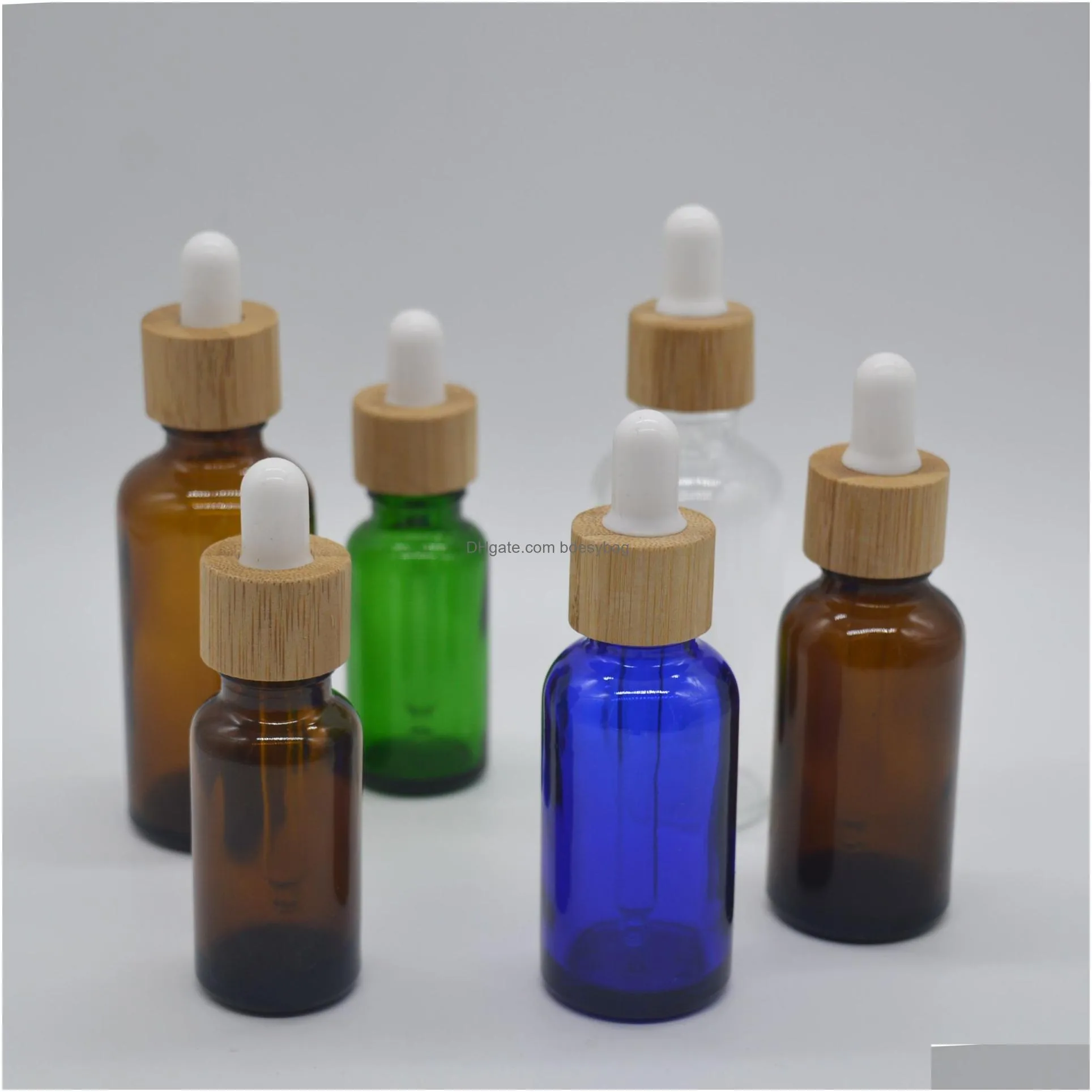 Packing Bottles Wholesale Glass Dropper Bottle 15Ml 30Ml 50Ml With Bamboo Cap 1Oz Wooden Clear Amber White Essential Oil Drop Delivery Dhbzu
