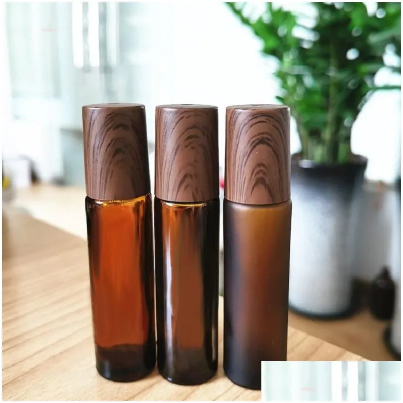 Roll On Bottles Wholesale 5Ml 10Ml 15Ml Amber Glass Roll-On Wood Grain Plastic Cap Frosted Essential Oil Per Bottle With Stainless Dro Dh1Zr