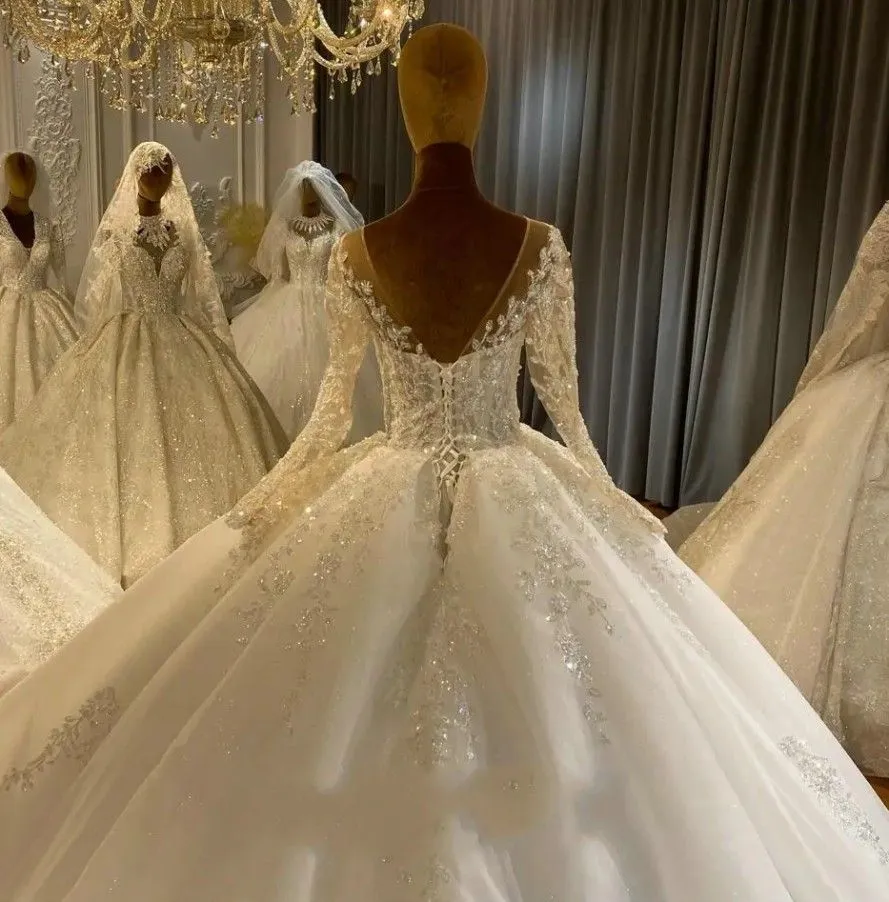 2024 Ball Gown Wedding Dresses Luxury Crystal Beads Lace Jewel Neck Illusion Long Sleeves Dubai Arabic Tulle Bride Bridal Gowns Vestido De Noiva Corset Back
