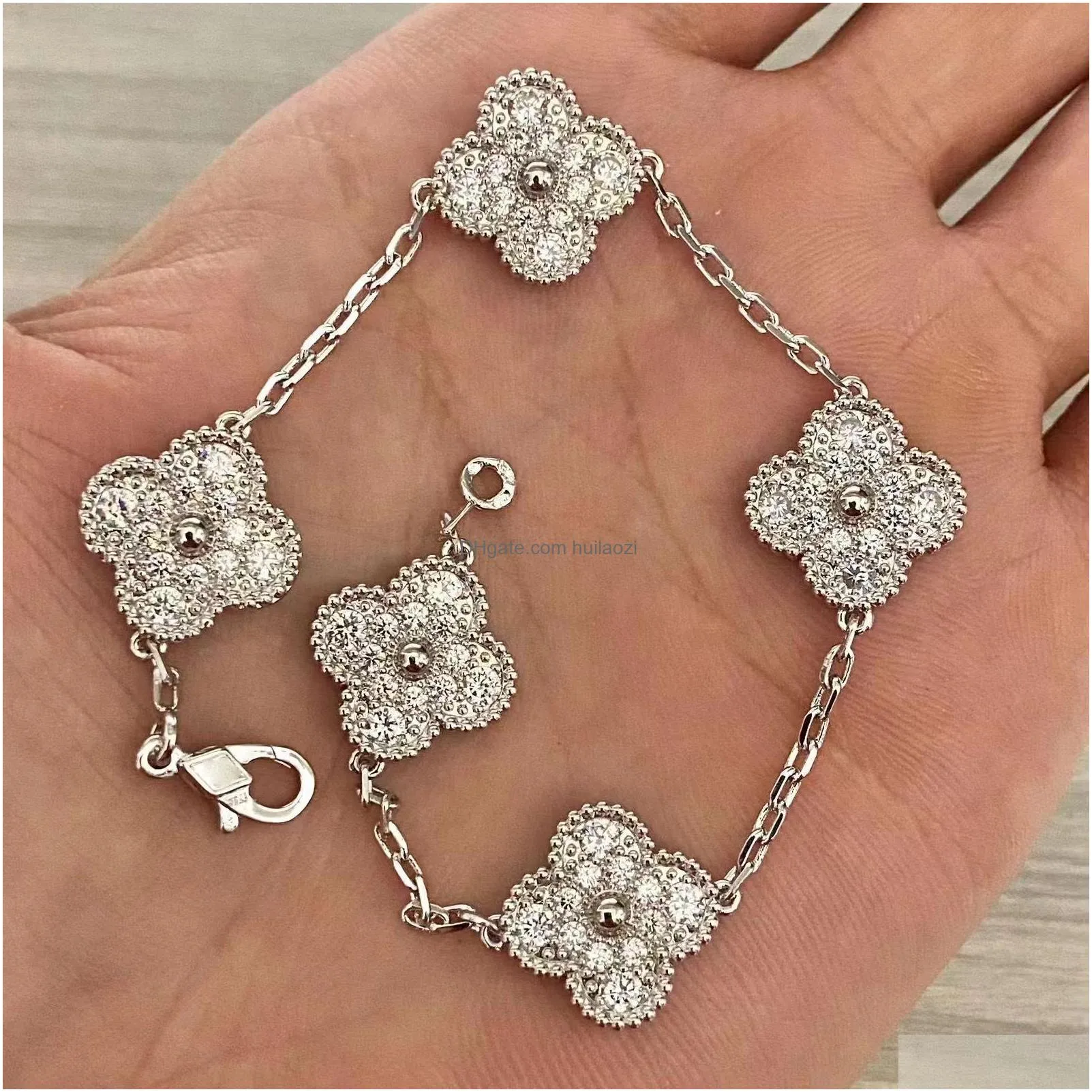 18k gold four-leaf clover charm bracelet with diamond accents - shell motif unisex fashion jewelry perfect for valentines day