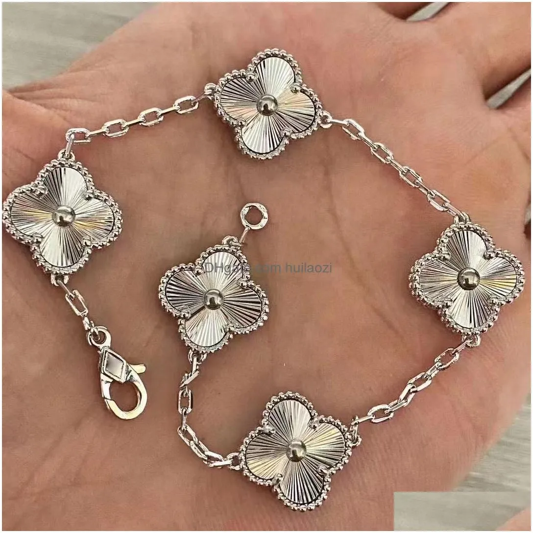 18k gold four-leaf clover charm bracelet with diamond accents - shell motif unisex fashion jewelry perfect for valentines day