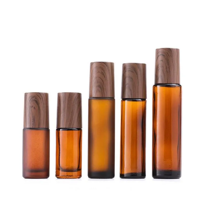 wholesale 5ml 10ml 15ml amber glass roll-on bottles wood grain plastic cap frosted  oil perfume bottle with stainless steel