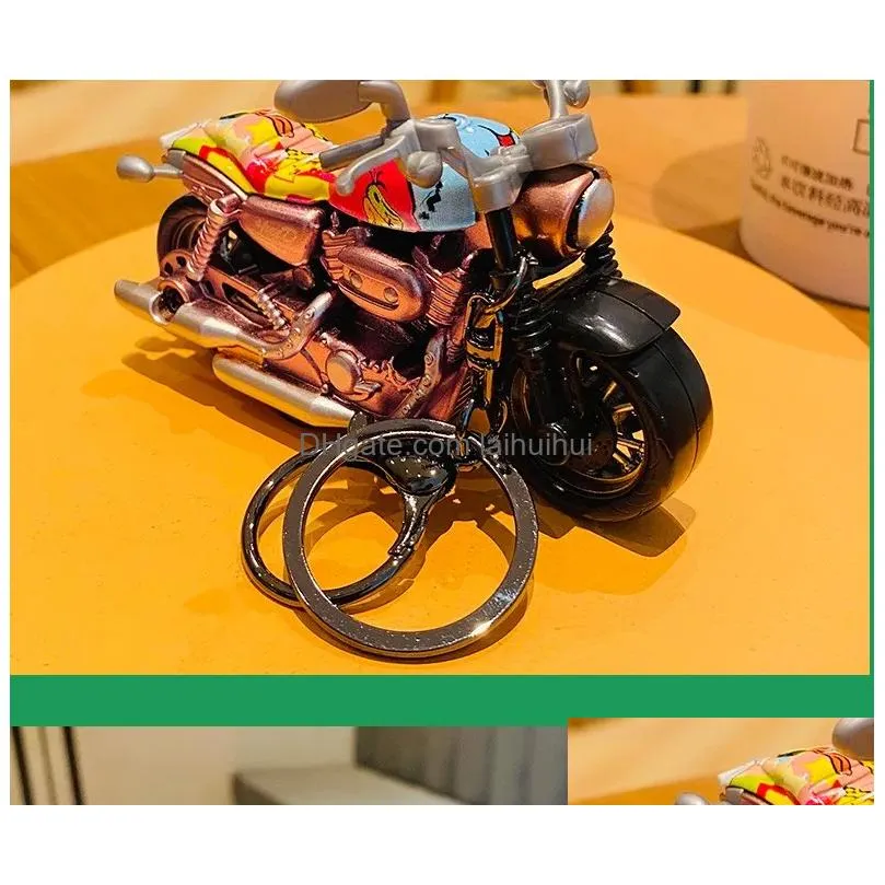 cartoon alloy rebound motorcycle toys creative car keychains exquisite school bags pendants childrens small gifts wholesale