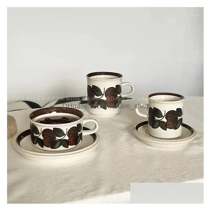 mugs the same type of medieval coffee cup and saucer in finland ceramic brown sea anemone hand-painted retro afternoon tea