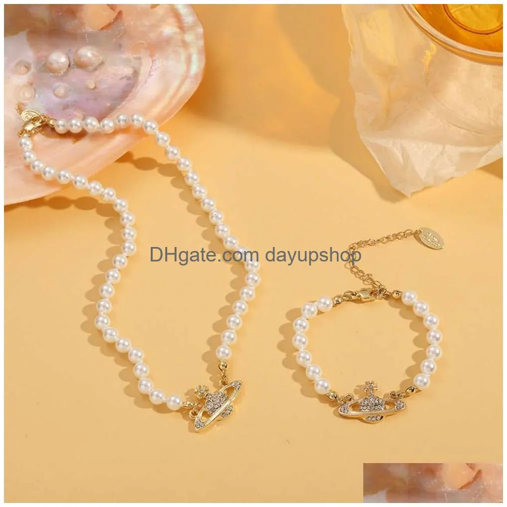 Designer High Quality Jewelry Planet Female Pendant Collar Chain Pearl Western Empress Dowager Necklace Bracelet Drop Delivery Dhaed