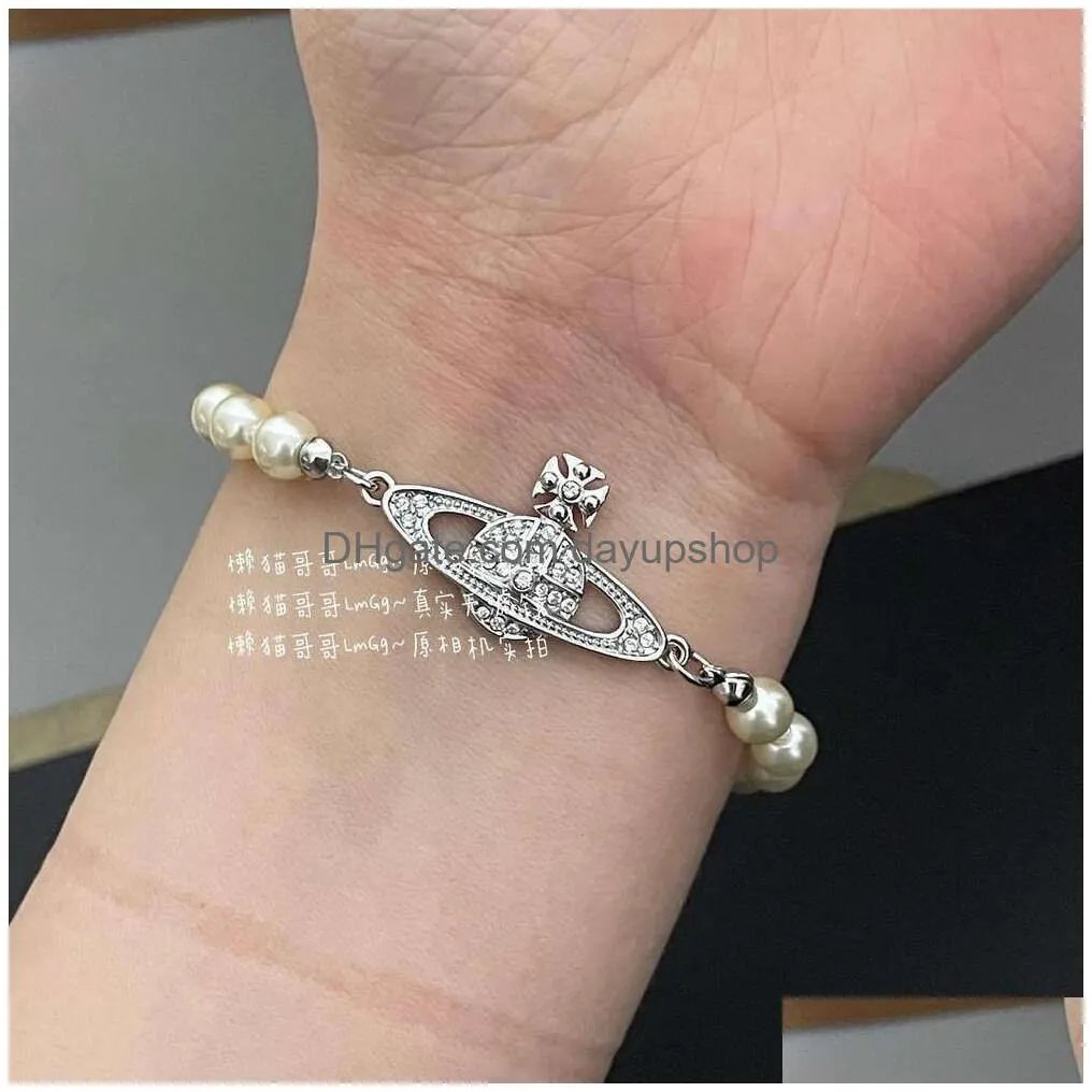 Designer High Quality The Western Empress Dowager Planet Is Same Type Of Agile Pearl Bracelet Instagram A Trendy And Minimalist Drop Dhdi6