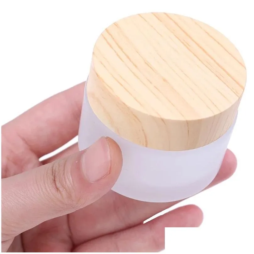 wholesale frosted glass jar skin care eye cream jars refillable bottle cosmetic container pot with plastic wood grain lids