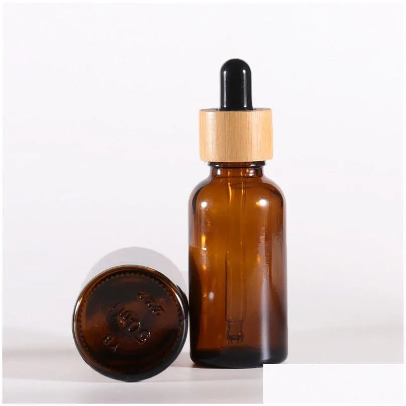 wholesale amber glass dropper bottle with bamboo lids  oils bottles sample vials for perfume cosmetic liquids 15ml 20ml 30ml 50ml