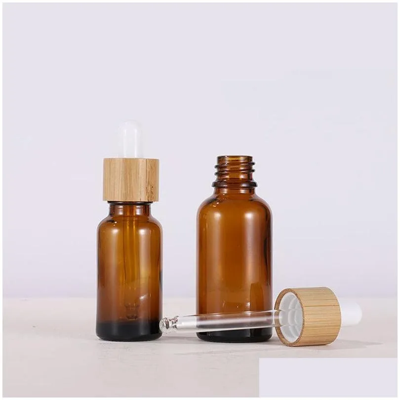 wholesale amber glass dropper bottle with bamboo lids essential oils bottles sample vials for perfume cosmetic liquids 15ml 20ml 30ml 50ml