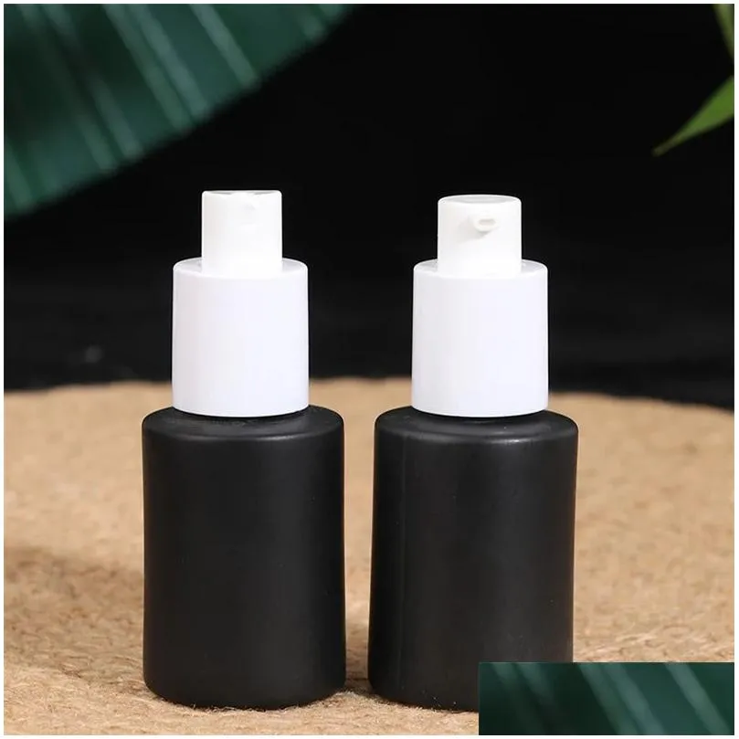 wholesale black frosted glass cream bottle cosmetic lotion spray bottles empty refillable jars with wood grain plastic lids