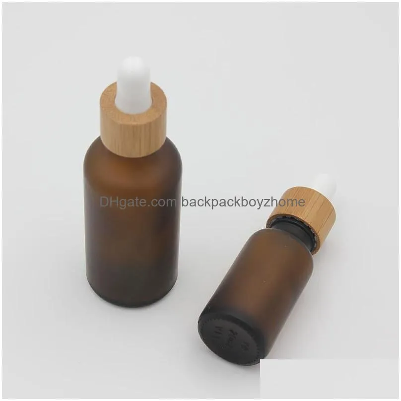 wholesale frosted amber white glass dropper bottle 15ml 30ml 50ml with bamboo cap 1oz wooden essential oil bottles