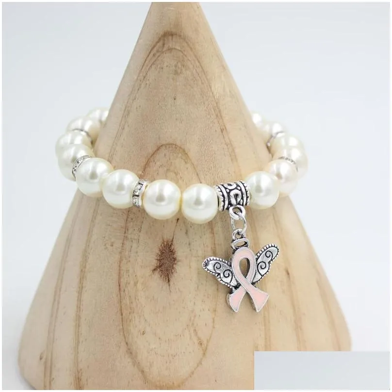 wholesale new arrival pearl bead breast cancer awareness bracelet angel wings pink ribbon charms bracelet jewelry for cancer center