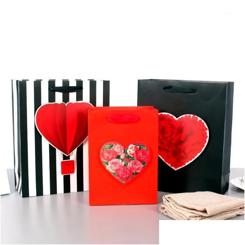 gift wrap happy valentines day paper bags with big heart/ balloon tipons holding gifts to show care love1