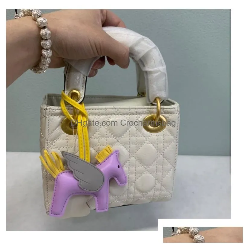 womens bag car pendant high-end handmade pu handbag key chains tassel flying rodeo horse bag charm