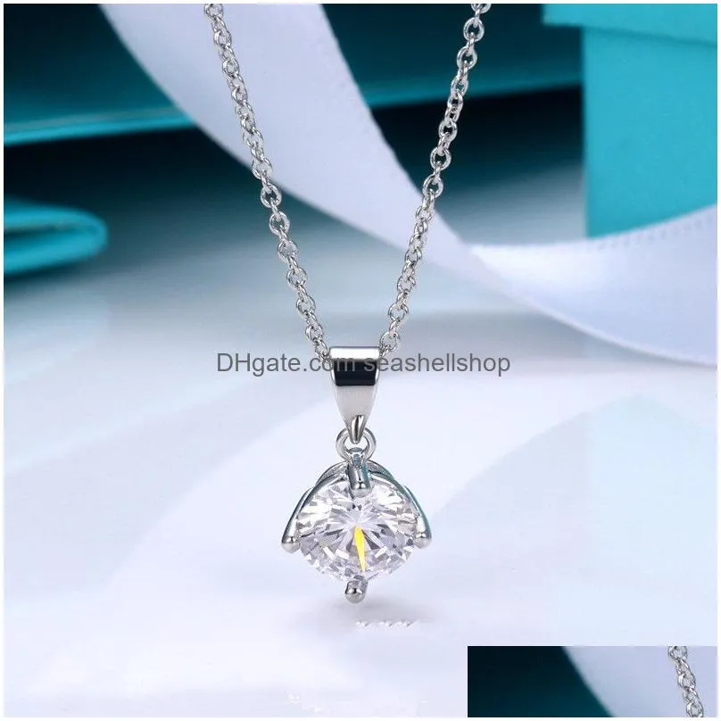 T home high-quality four-claw hollowed out diamond insert simulation Mossang diamond simple women`s single diamond pendant necklace earrings