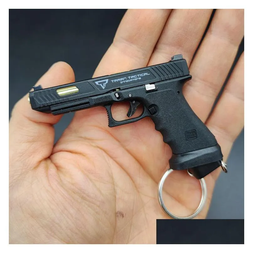 g34 gun tti speed chasing shell ejection pistol alloy miniature toy gun keychain survival pistol model detachable bullet throwing 2082