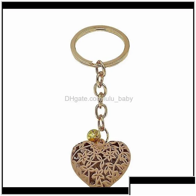 Aessories20Pcs/Lot Wholesale Hollow Heart Fashion Charm Cute Purse Bag Pendant Car Keyring Chain Ornaments Gift Keychains T200804 655 Drop