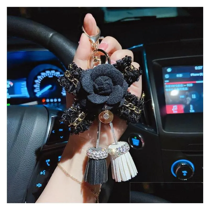 keychains luxury black camellia genuine leather flower keychain letter umbrella pendant car key chain ring for bagkeychains