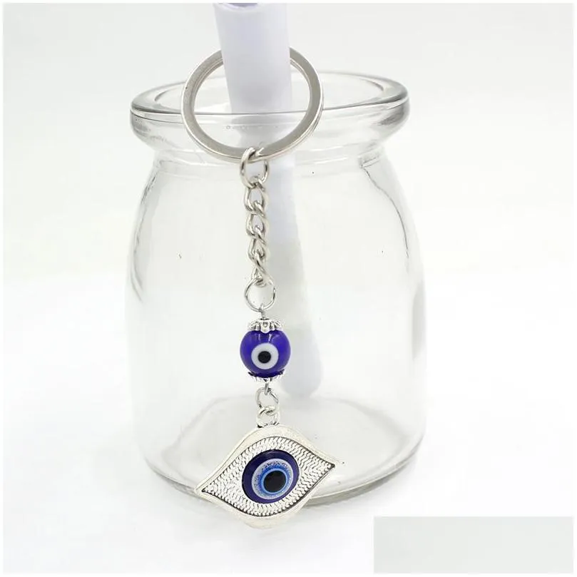 wholesale round cylinder ceramics blue turkish evil eye keychain car keyring lucky eyes hamsa hand key chain for women men jewelry