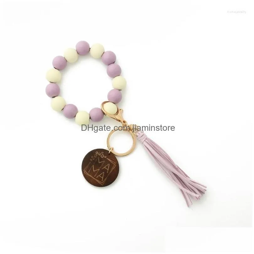 strand handbeaded spotted wood bead bracelet keychain with stylish tassel design
