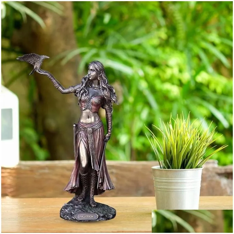 Decorative Objects & Figurines Resin Statues Morrigan The Celtic Goddess Of Battle With Crow Sword Bronze Finish Statue 15Cm For Home Dhrjj