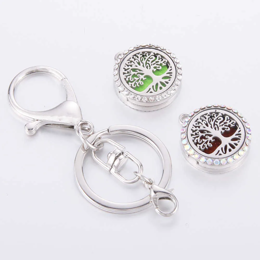 Diamond Inlaid Hollow Stainless Steel Pattern Aromatherapy Essential Oil Magnet Keychain Metal Bag Accessory Car Key Pendant