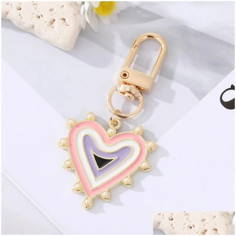 Keychains & Lanyards Rhinestones Pearl Evil Eyes Keychains Alloy Men Women Peach Love Heart Devils Bag Car Keychain Pendant In Bk Dro Dhuoz