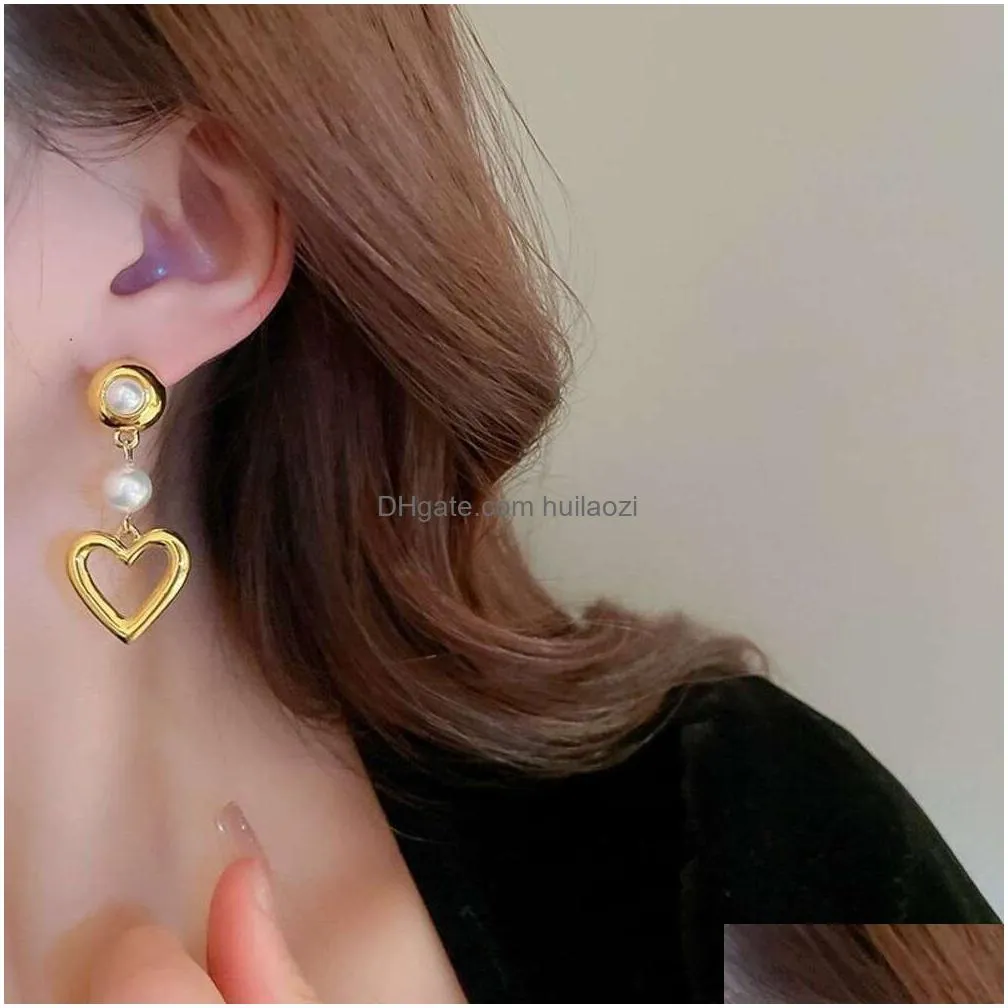 sier needle hollowed out metal love pearl fashionable and high-end feel versatile temperament earrings with heart