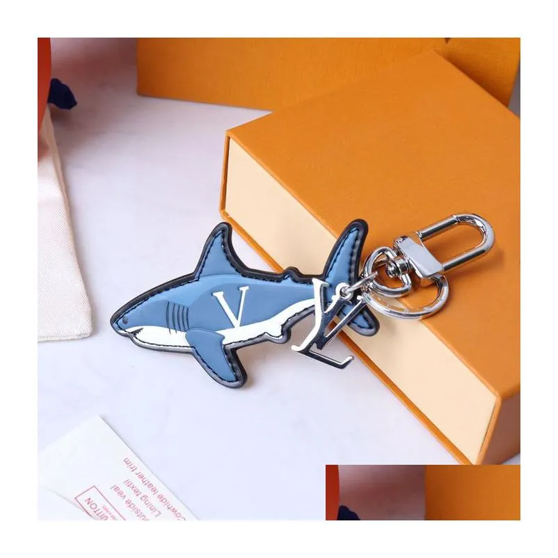 Keychains & Lanyards Cartoon Keychains Luxury Designer Fashion Keychain Sliver Keys Buckle Genuine Leather Blue Shark Pendant Letter Dhrcn