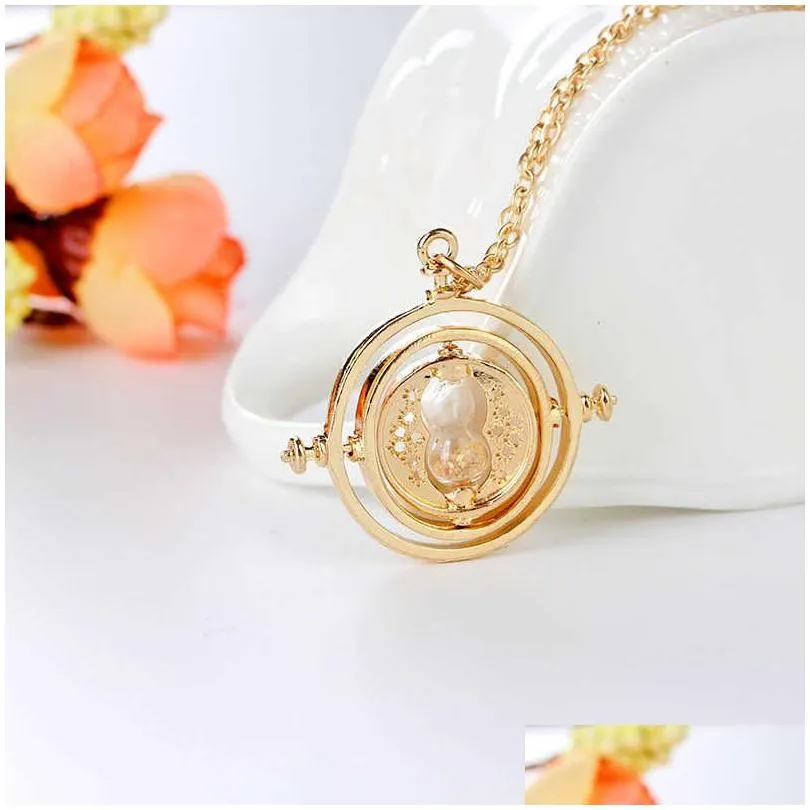 24 pcs lot selling 3 5 cm diameter time turner necklace movie jewelry rotating hourglass pendant bulk whole 210929244z