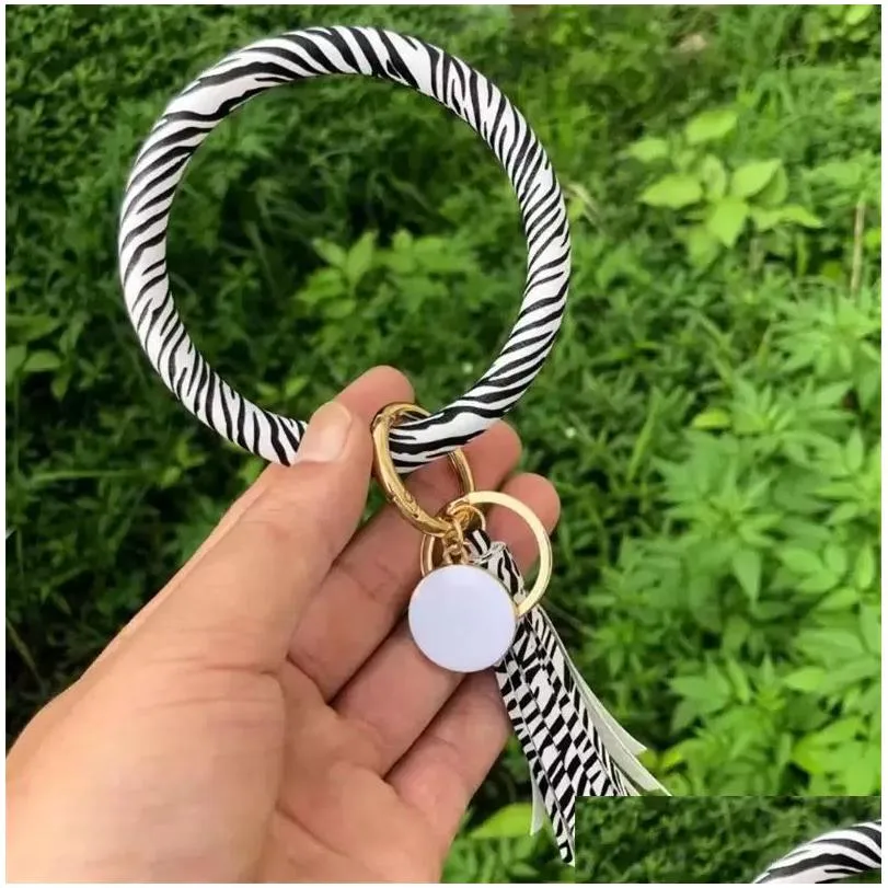 fashion party favor multiple designs sun flower pattern key chain leather wrap tassels bracelets keychain wristlet bracelet tassel round bangle keyring