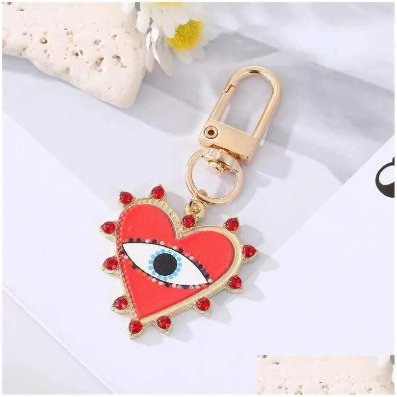 rhinestones pearl evil eyes keychains alloy men women peach love heart devils eyes bag car keychain pendant in bulk