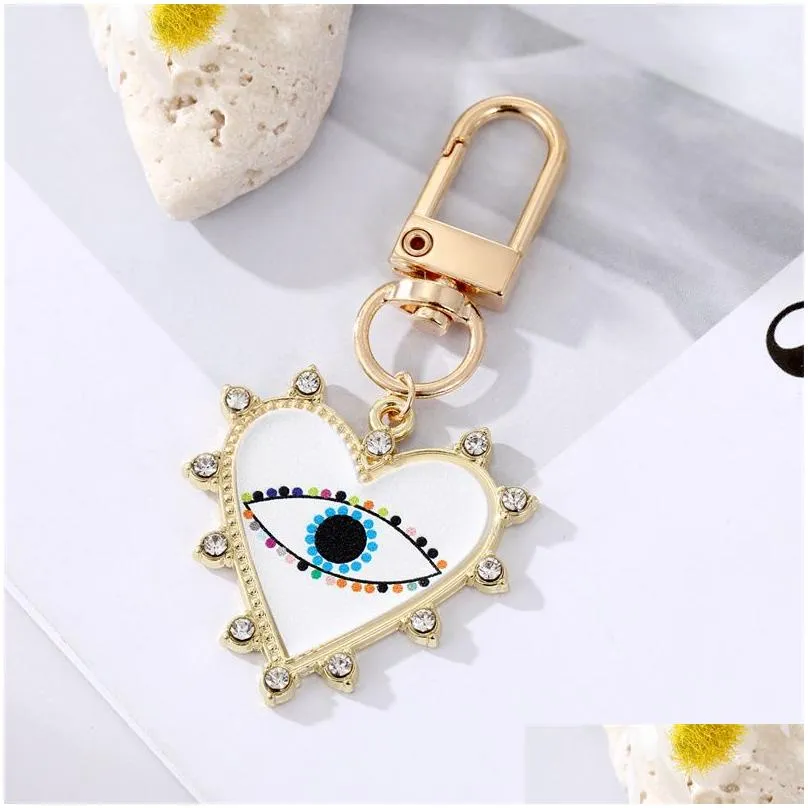 rhinestones pearl evil eyes keychains alloy men women peach love heart devils eyes bag car keychain pendant in bulk