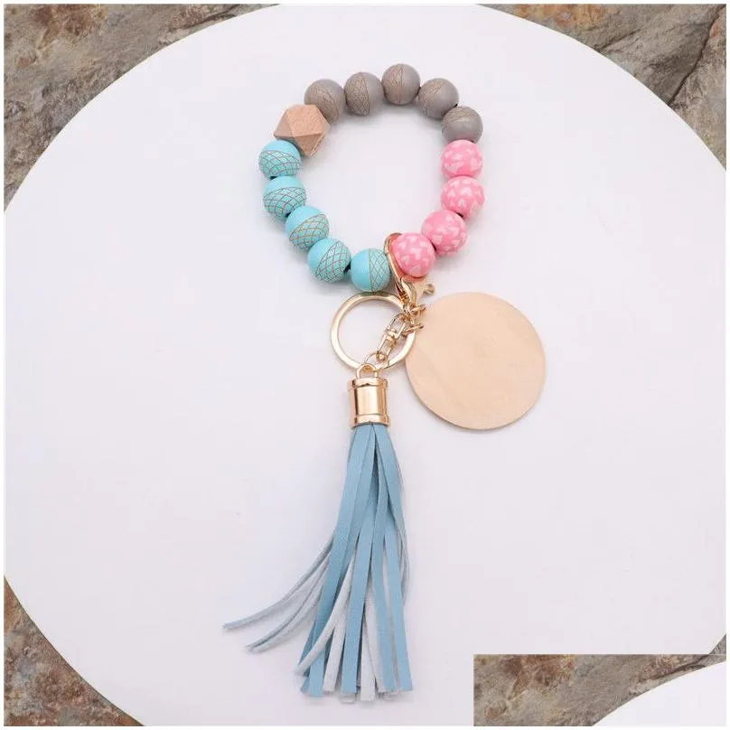 wristlet keychain key ring bracelet silicone beaded wrist cute keychains for women bangle elastic portable car keyrings chains girls with faux leather tassel