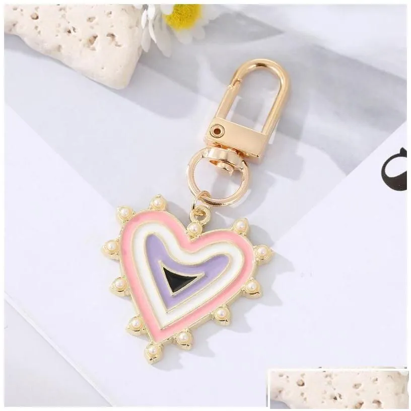 Keychains & Lanyards Keychains Lanyards Rhinestones Pearl Evil Eyes Alloy Men Women Peach Love Heart Devils Bag Car Keychain Dhgarden Dhov4