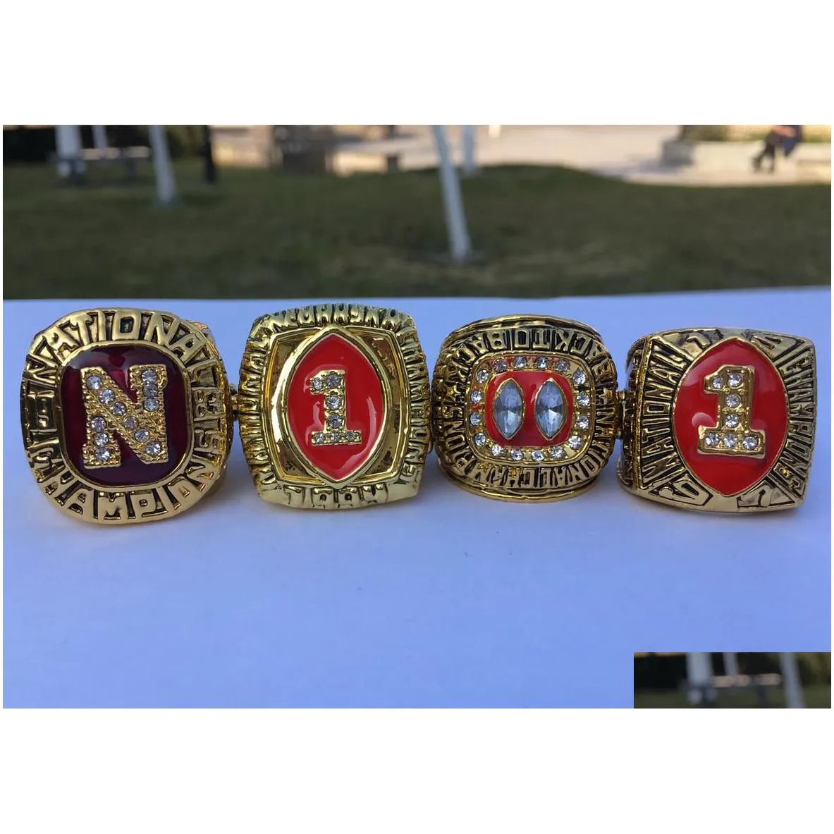 4pcs 1983 1994 1995 1997 nebraska cornhuskers national championship ring with wooden display box men fan gift 2019 wholesale drop