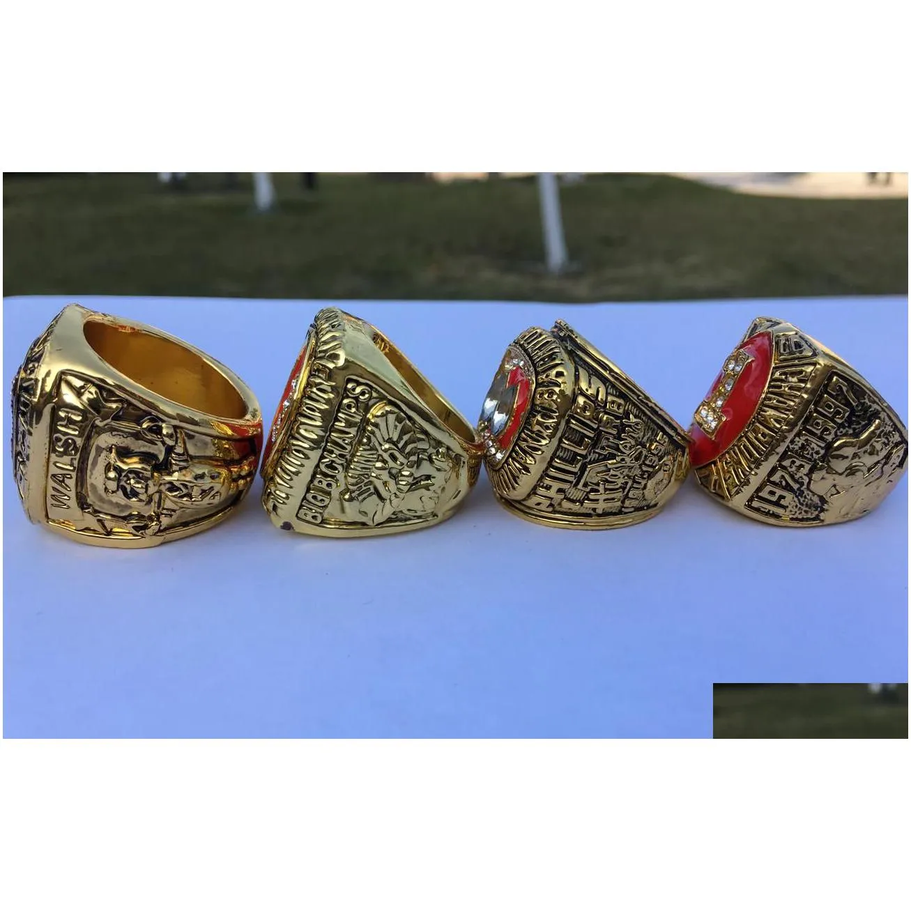 4pcs 1983 1994 1995 1997 nebraska cornhuskers national championship ring with wooden display box men fan gift 2019 wholesale drop