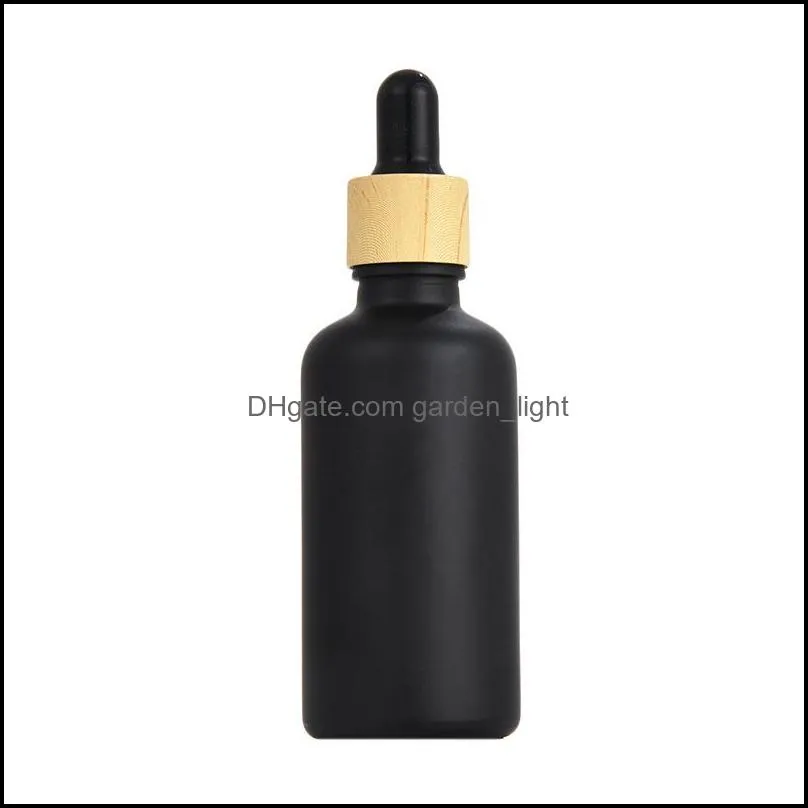 matte black coated glass dropper bottle boston round essential oils perfume bottles with wood grain plastic cap
