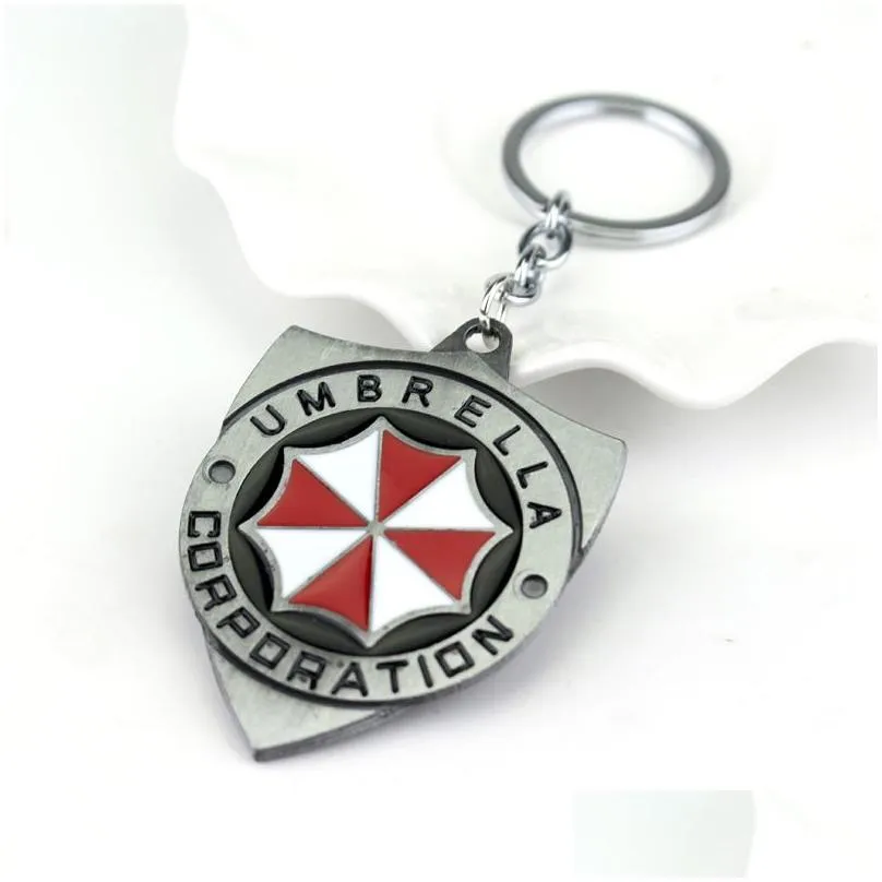 Keychains & Lanyards Resident Evil 2 Colors Alloy Keychain Umbrella Corporation Logo Shield Shape Hoder For Fans Unique Movie Jewelry Dhnyh