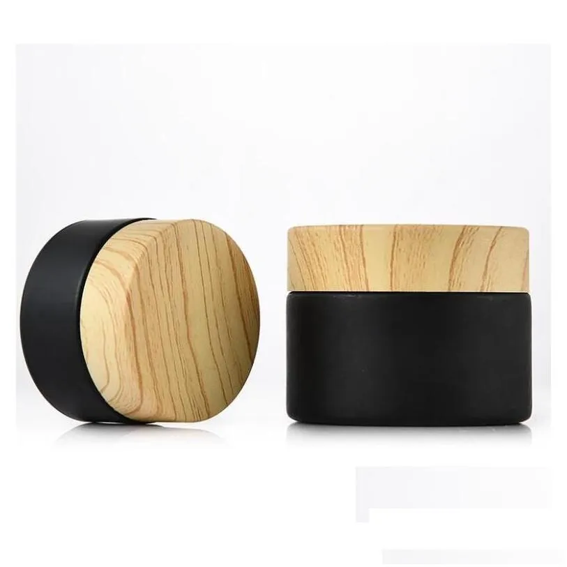 wholesale packing bottles wood lid bottle wholesale black frosted glass jars cosmetic jar with woodgrain plastic lids pp liner 5g 10g 15g 20g