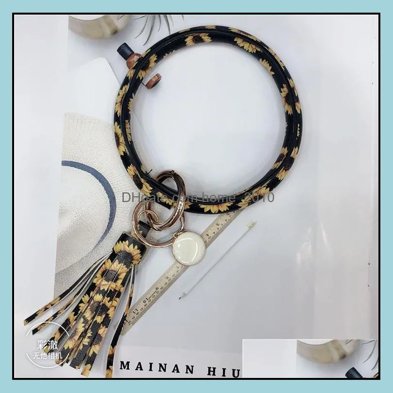 leopard leather bracelet keychain pu wrist round tassel pendant party wristbands bangle floral keychain rings women girl hands 
