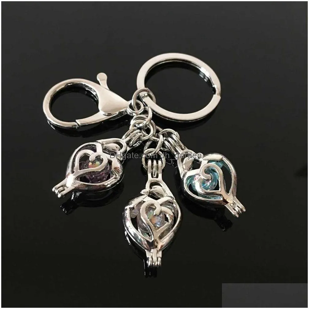 european and american feather pearl cage key ring can open hollow noctilucent volcanic stone pendant keyring