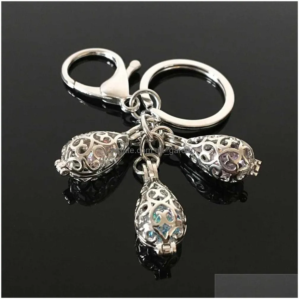 euroamerican paw print pearl cage key ring can open hollow noctilucent volcanic stone pendant keyring