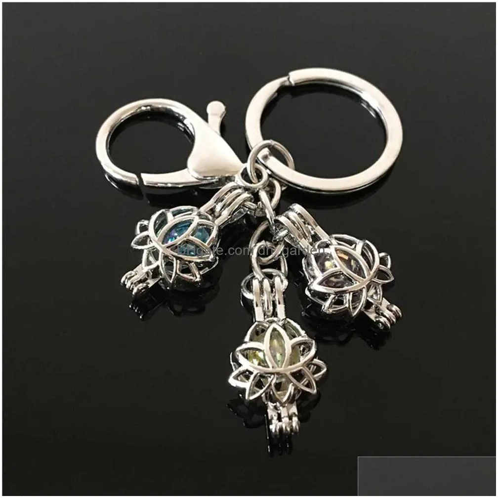 european and american feather pearl cage key ring can open hollow noctilucent volcanic stone pendant keyring