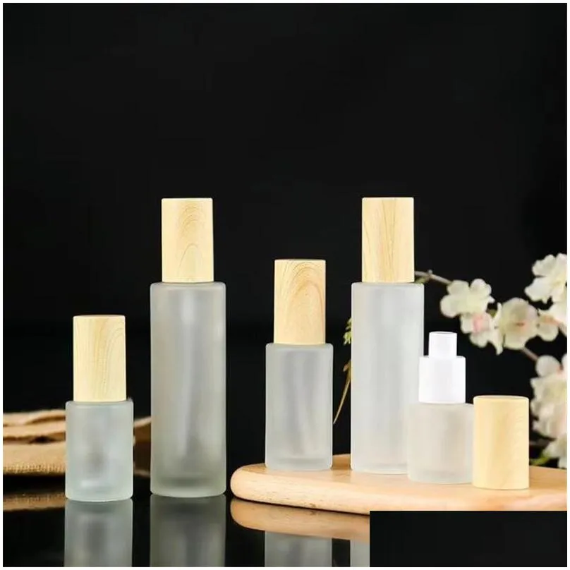 Packing Bottles Wholesale Frosted Glass Cream Jar Cosmetic Lotion Spray Bottle With Imitated Wooden Lids Refillable Container 20Ml 30M Dhvqs