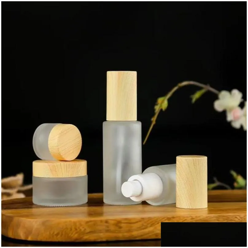 Packing Bottles Wholesale Frosted Glass Cream Jar Cosmetic Lotion Spray Bottle With Imitated Wooden Lids Refillable Container 20Ml 30M Dhvqs