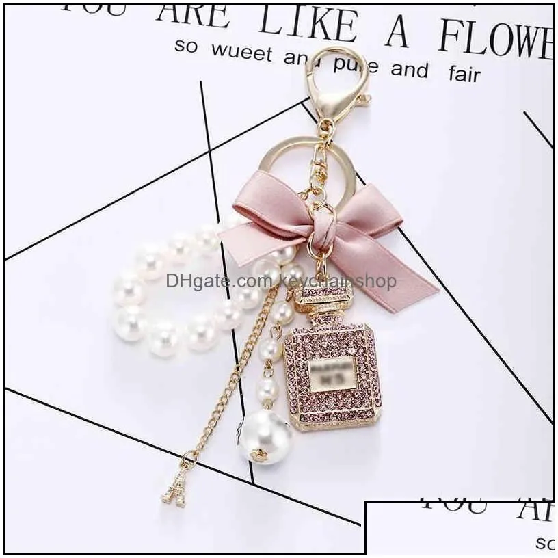 keychains fashion accessories creative handmade diy diamond per bottle alloy bow pearl luxury keychain purses charm pendant ys068 drop