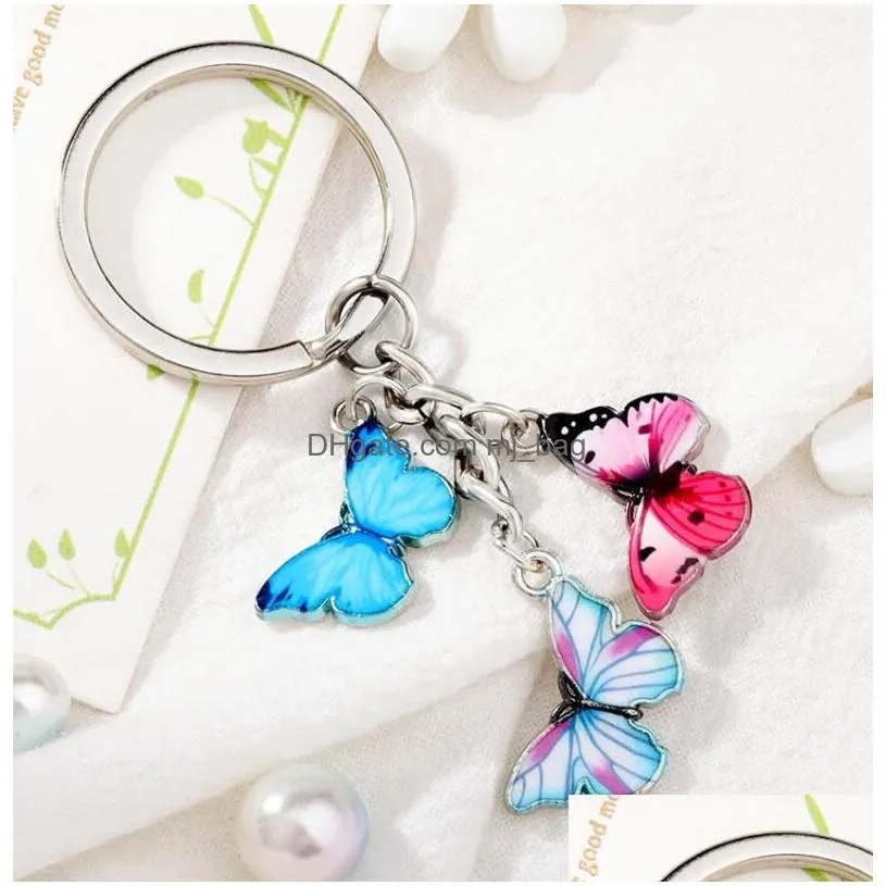 Party Favor New Style Key Chain Colorf Butterfly Bag Charm Cell Phone Accessory Preppy Schoolbag Pendant Home Garden Festive Party Sup Dhklf